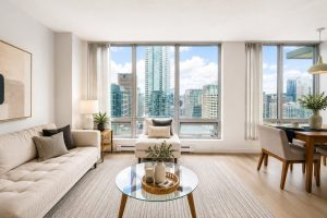 Living and dining area with panoramic Coal Harbour views – 3304 Residences on Georgia Vancouver West End condo